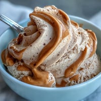 Creamy 4-ingredient peanut butter banana ice cream, a naturally sweet frozen treat.
